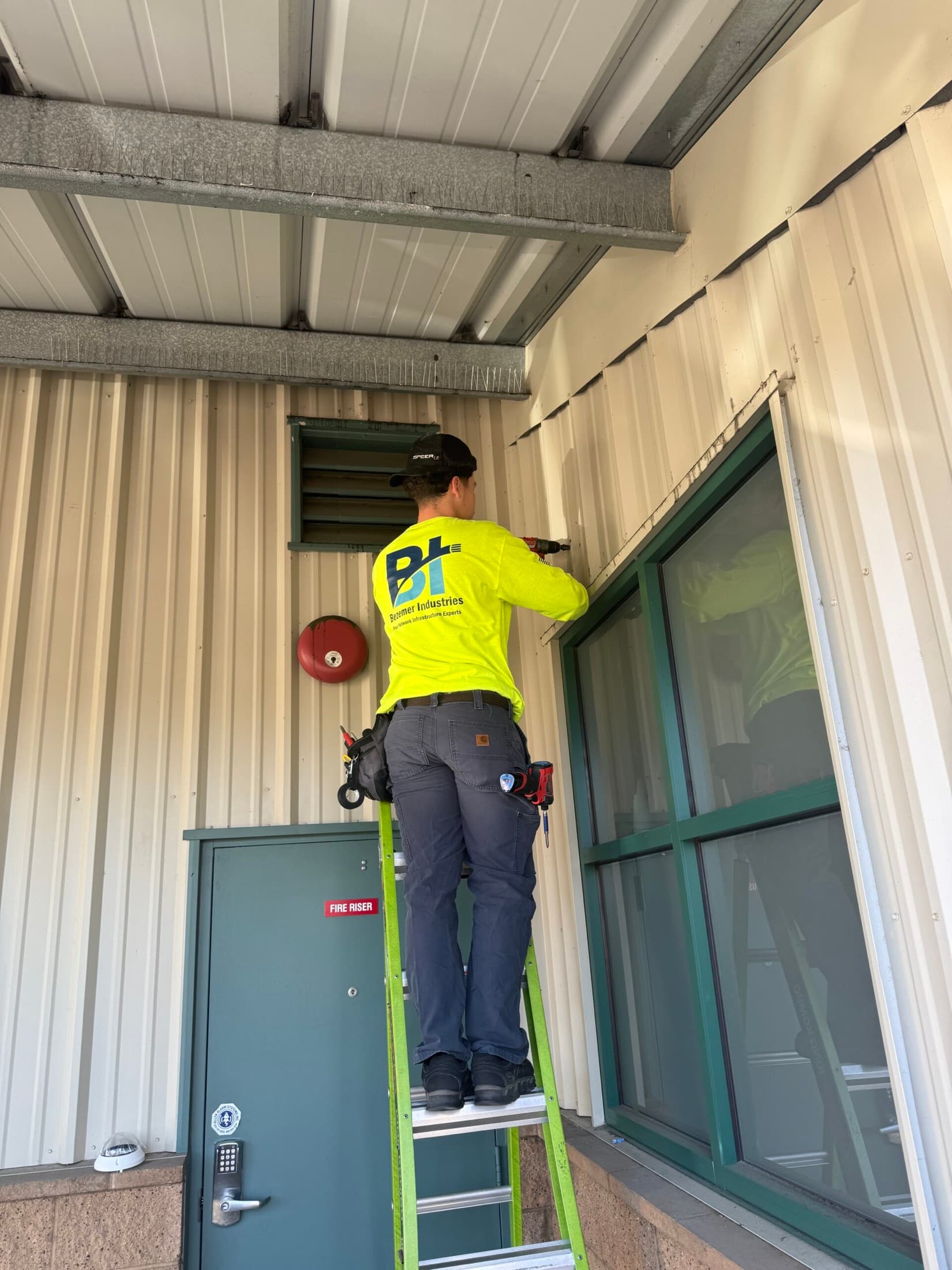 Bezemer Industries technician working on commercial access control at a Central Valley facility